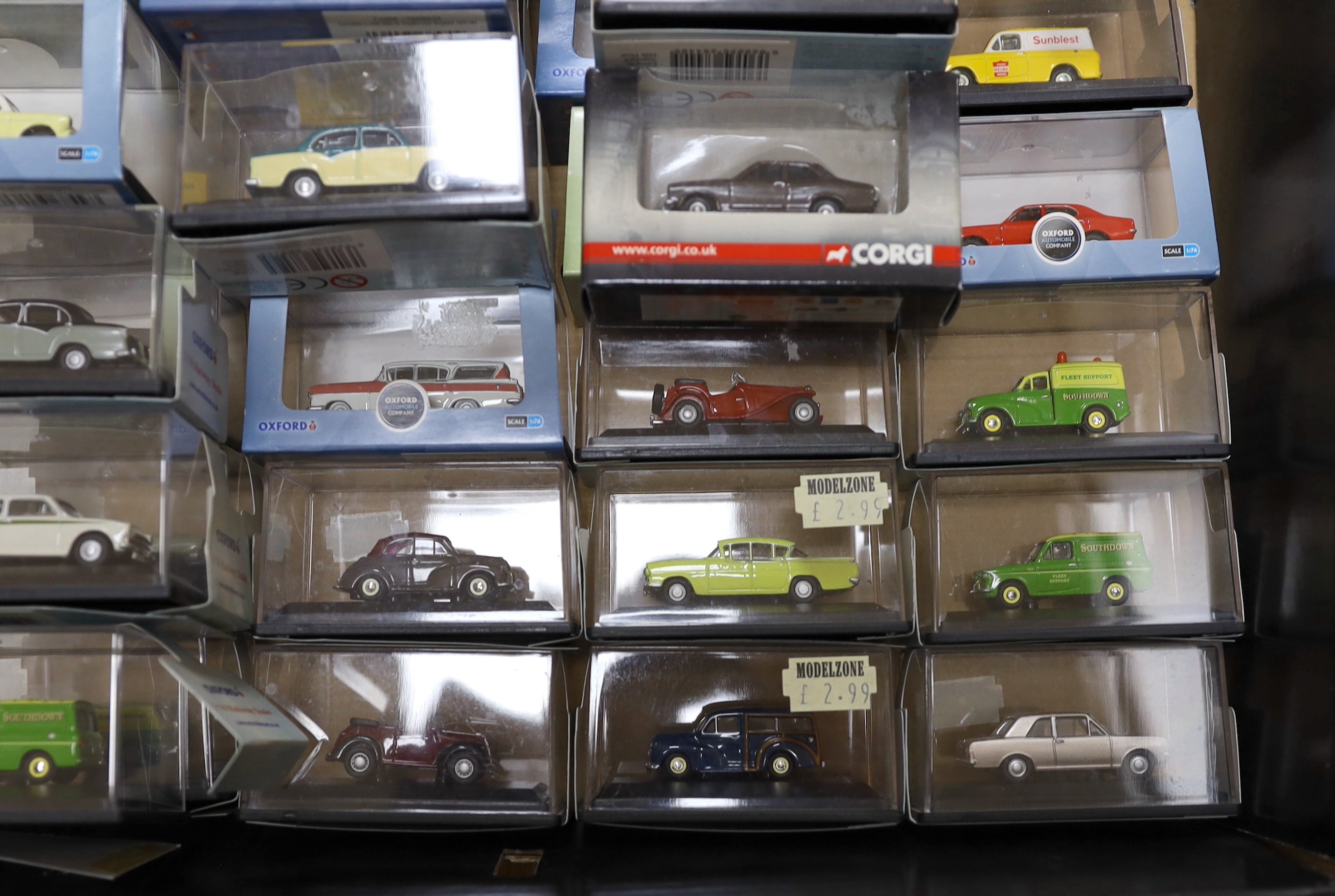 A collection of boxed 00 gauge 1:76 scale vehicles by Oxford Diecast and Corgi, including mainly 1950s/60s/70s cars and light commercial vehicles (54)